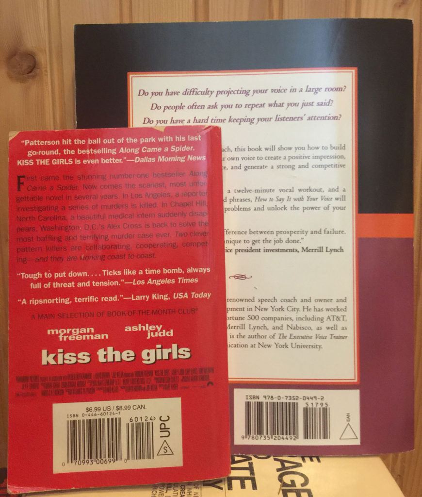 Mass-market paperback on left side, with the triangle and the letter S indicating that the book is strippable; Trade paperback on right side with triangle with no letter S indicating that the book is not strippable. Also, notice the price and size differences. In addition, the mass-market book has a UPC barcode; and the trade has a Bookland/EAN barcode.